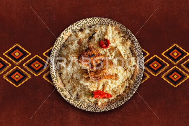 A dish of Kabsa rice with chicken and vegetables, traditional Arab Gulf meals, popular dishes, oriental restaurants for Saudi cuisine recipes, a textured brown background