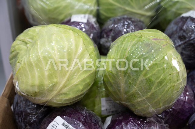 Close-up of the cabbage vegetable section, shops, shopping inside the supermarket, buying household needs, various commodities and foodstuffs, consumer supplies.