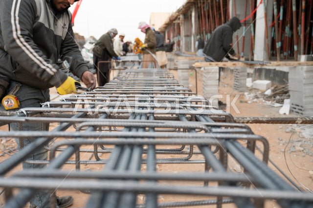 Close-up of a worker at a construction site, architectural development, architecture concept, building under construction, Saudi Arabia