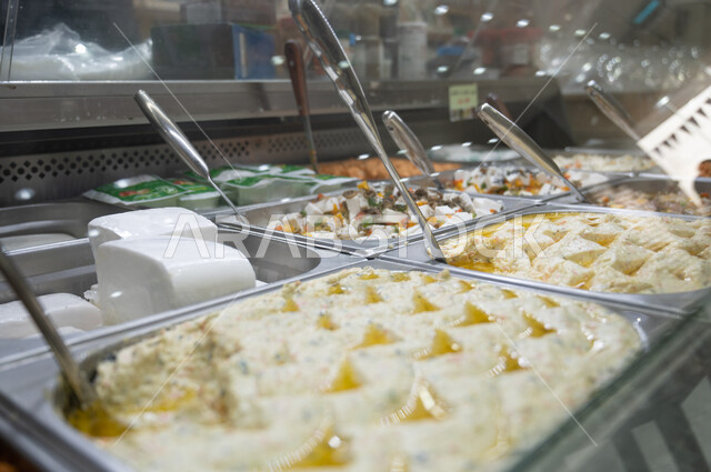 Close-up of a variety of fresh appetizers in the supermarket, light and ...