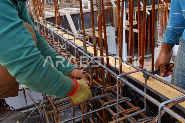 Construction workers doing roof construction, construction equipment and tools, construction work, metal skewers, steel iron, preparing skewers for building roofs