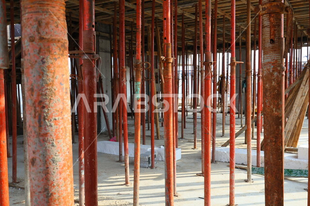 Close-up of floor building support columns, solid iron columns, construction tools and equipment, floor building columns, architectural development, construction work