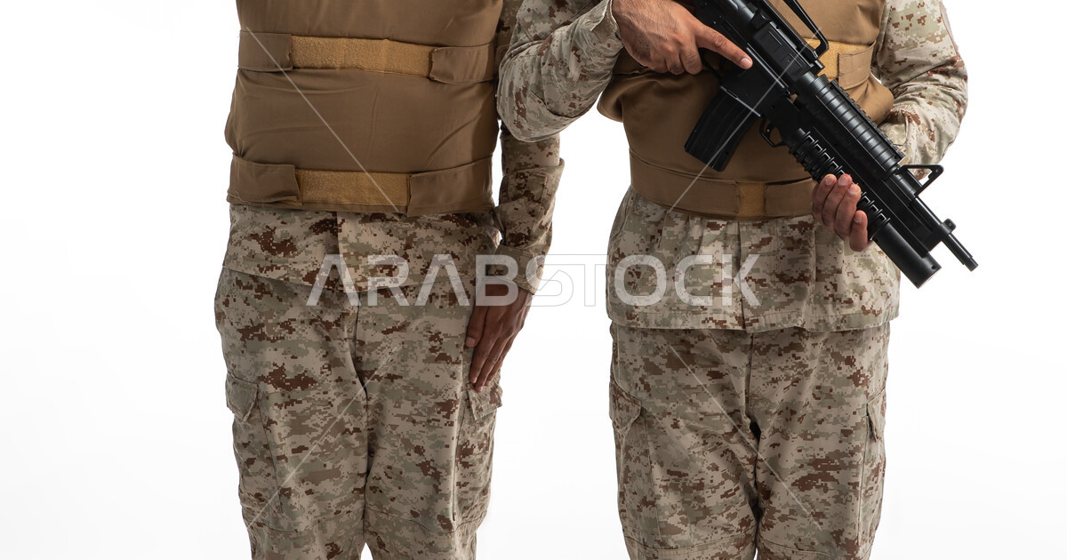 Carrying arms and defending the homeland, a portrait of two Saudi Arabian Gulf soldiers wearing