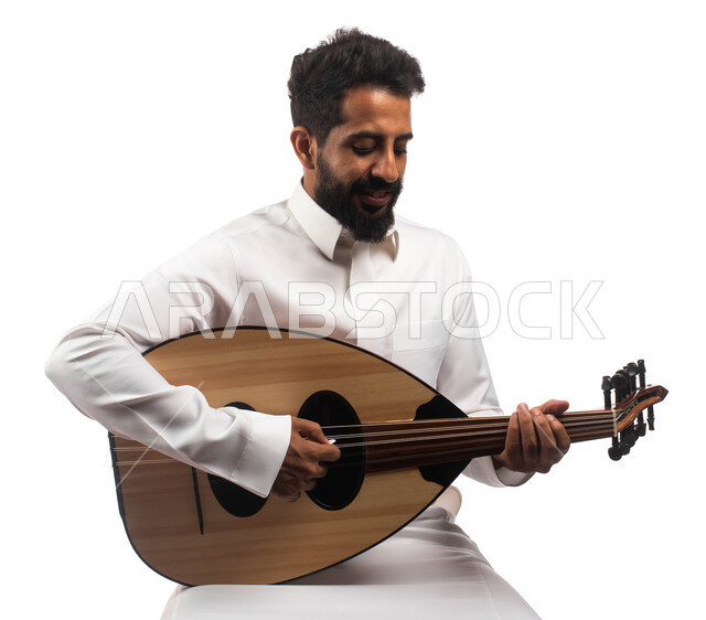 A session, people and mirth, musical artistic talents, a portrait of a Saudi Arabian Gulf artist who practices the hobby of playing using the oud instrument, presenting programs, musical arts and theatrical art, enjoying playing the stringed instrument, e