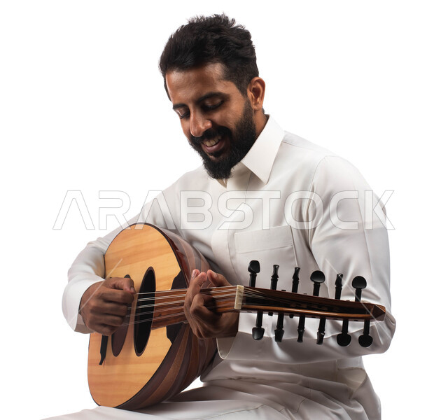 Musical artistic talents, a portrait of a Saudi Arab Gulf artist who practices the hobby of playing with the oud instrument, presenting programs and musical arts and theatrical art, enjoying playing the stringed instrument, a sitting, people and rapture, 