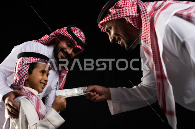 Portrait of a Saudi Arabian Gulf family dressed in Saudi traditional dress, facial gestures indicating joy and happiness for a young child, presenting Eidiya to children, celebrating the advent of Eid, Eid atmosphere in Saudi Arabia, Eid visits, black bac