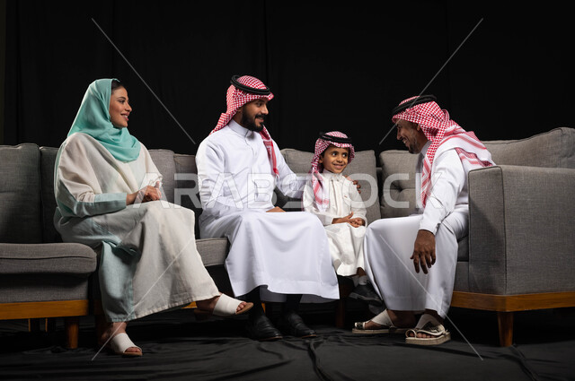 An exchange of conversations for a Saudi Arabian Gulf family celebrating the advent of the happy Eid, a portrait of the Eid atmosphere in Saudi Arabia, the celebration of the advent of the Eid, chat and conversations, happy family messages, a black backgr