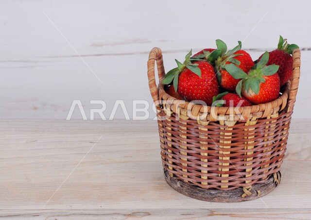A group of strawberries inside the basket, fresh fruits, ripe strawberries, healthy and delicious fruit, white background.