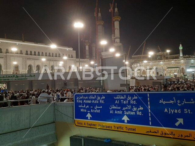 Pilgrims and Umrah performers in the outer perimeter of the Holy Mosque in Makkah Al-Mukarramah in the Kingdom of Saudi Arabia at night, the courtyard of the Holy Mosque of Mecca, the Grand Mosque in Mecca, sacred Islamic landmarks