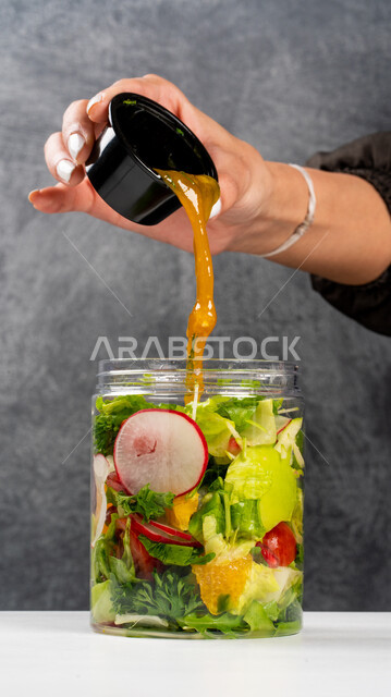 Healthy diet meals, mix of fresh vegetables, mixed vegetable salad, healthy food restaurants, gray background
