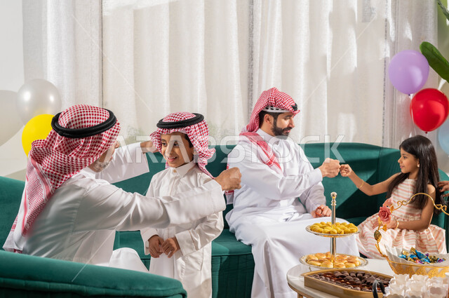 The feast between the family, the joy and joy of the feast, the family gathering, the feast customs in the Saudi Gulf society, the celebrations and visits of the Saudi family in the happy feast, Islamic holidays and occasions.