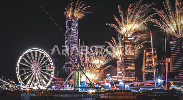 الالعاب النارية في مركز الملك عبد الله المالي (كافد) في الرياض بالسعودية ليلا، ملاهي ونتر لاند، ابراج وناطحات سحاب، ابراج مالية اقتصادية، الهندسة المعمارية في الرياض، الالعاب والمفرقعات النارية، معالم الرياض المشهورة