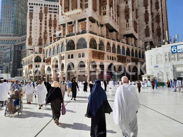 Pilgrims and Umrah performers in the courtyard of the Grand Mosque, the Grand Mosque in Makkah Al-Mukarramah in the Kingdom of Saudi Arabia, the Noble Sanctuary of Mecca, performing the rituals of Hajj and Umrah, Islamic religious landmarks, Islamic holy 