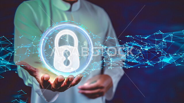 صورة مقربة ليد رجل عربي خليجيي سعودي يحمل في يديه أيقونة قفل الأمان المضيئة باستخدام خاصية الهولوجرام ثلاثي الأبعاد، الآمن السبراني، مفهوم آمن تكنولوجيا المعلومات، الحماية والأمان