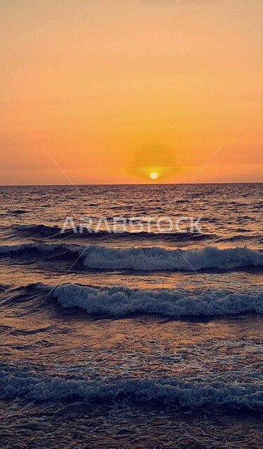 View of the sunset on the seashore in the Kingdom of Saudi Arabia, the waves of the Red Sea, coastal tourist places, the background of the marine nature in Saudi Arabia.