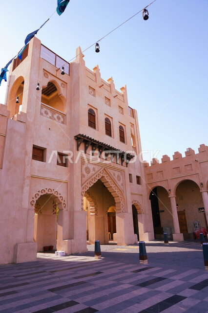 A side view of the ancient, popular historical Qaisariya market from the outside, the entrance to the Qaisariya market in the city of Al-Ahsa (the land of civilization) in the Kingdom of Saudi Arabia, the tourist attractions in Saudi Arabia