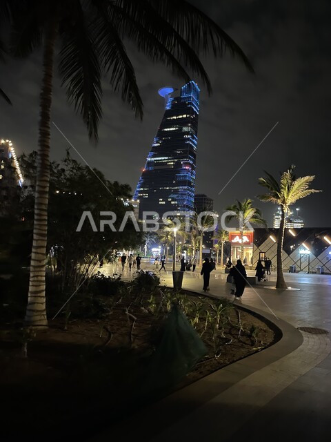 Palm trees in the squares of the Corniche in Jeddah, Saudi Arabia, at night, towers and skyscrapers, famous Jeddah towers and landmarks, tourism in Saudi Arabia
