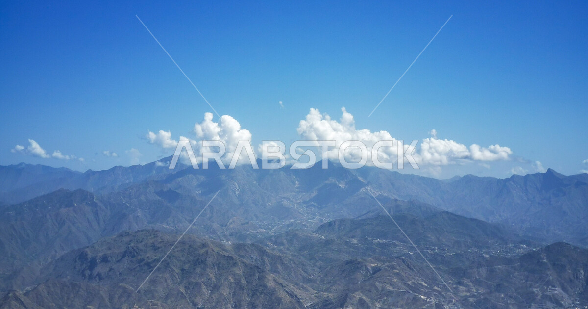 A huge chain of mountains and mountain heights, residential homes at ...