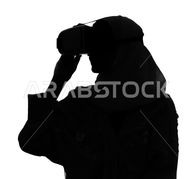 Entertaining technical activities, enjoying watching virtual reality movies, a silhouette portrait of a Saudi Arabian Gulf woman wearing virtual reality glasses, spending quality time playing with virtual games, white background, cellulite