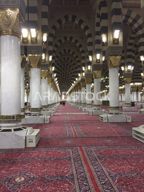 Worship and getting closer to God, a picture from inside the Prophet's Mosque in Medina in the Kingdom of Saudi Arabia, Islamic designs and decorations, architectural engineering art, Islamic and worship, Islamic holy places