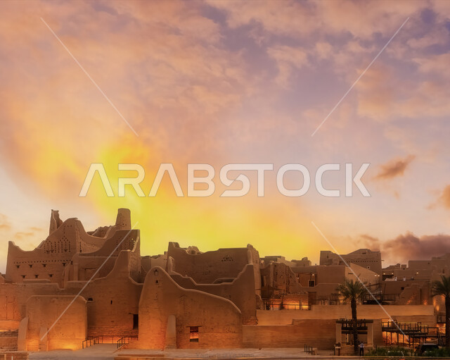 The ancient walls of Diriyah in the city of Riyadh in the Kingdom of Saudi Arabia at sunset, the historical Al-Turaif neighborhood, a cultural and tourist center, the ancient buildings in Diriyah, the historical landmarks of Saudi Arabia
