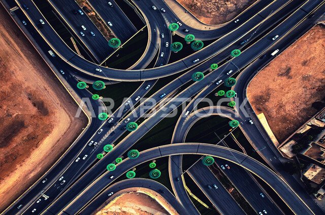 صورة من الاعلى لميدان تقاطع طريق الملك عبد الله مع طريق الملك خالد في مدينة الرياض في المملكة العربية السعودية، مجسمات على شكل اشجار خضراء، حركة مرور السيارات، معالم الرياض المشهورة