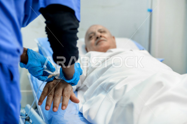 An old man, Arab, Gulf, Saudi, patient lying on a hospital bed, receiving treatment and care in the hospital, performing surgery, a hospital for the elderly, the concept of medicine and health care