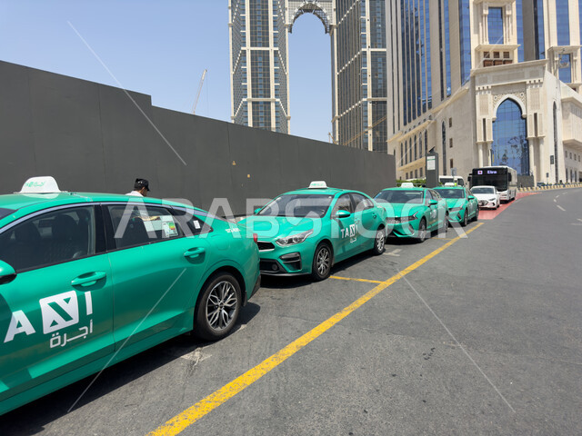 Green private taxis for transporting pilgrims and Umrah performers to Makkah Al-Mukarramah, getting closer to God with good deeds, visiting the Sacred House of God in Makkah Al-Mukarramah, performing Hajj and Umrah in the Hajj season 2023, sacred religiou