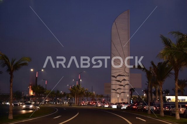 طرق ومعالم سياحية مشهورة في كورنيش جده المطل على البحر الأحمر, صورة ليلية لميدان النورس في مدينة جدة في المملكة العربية السعودية، الابراج وناطحات السحاب، جمالية الفن و التصميم الهندسي المعماري الحديث.