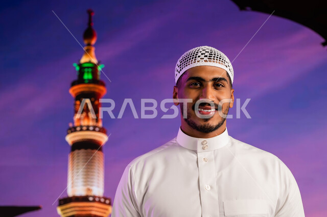 The virtue of prayer and supplication in the Mosque of the Messenger of God, the arrival of Muslims from all over the world to the holy places in Medina, a Saudi Arab Gulf Muslim man standing in the courtyard of the Prophet’s Mosque, worship and closeness