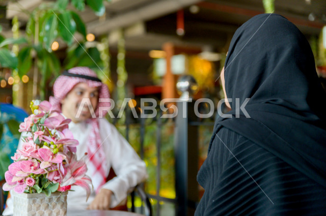 A Saudi Arabian Gulf couple spend a romantic and wonderful atmosphere in the restaurant, celebrate the anniversary of marriage, celebrate Valentine's Day, a birthday event, a unique and special session, restaurants and cafes in Saudi Arabia