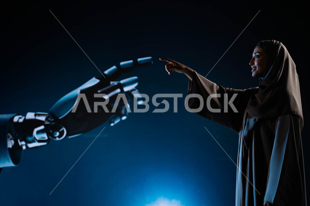 تكنولوجيا رؤية مستقبلية سعودية 2030, التحول الرقمي والتقدم التقني، رجل آلي عصري متطور, بورتريه لامرأة عربية خليجية سعودية محجبة تلامس يد روبوت ذكي متطور, برمجة وتحديث تقنية الذكاء الاصطناعي, خلفية زرقاء.