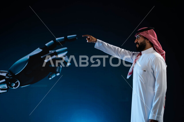 برمجة وتحديث تقنية الذكاء الاصطناعي, رجل آلي عصري متطور, بورتريه لرجل عربي خليجي سعودي يرتدي الزي السعودي التقليدي يلامس يد روبوت ذكي متطور, تكنولوجيا رؤية مستقبلية سعودية 2030, التحول الرقمي والتقدم التقني، خلفية زرقاء.