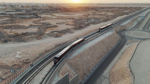 A metro train rides to a modern station in the city of Riyadh