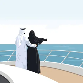 Arab couple on luxury yacht looking at the ocean