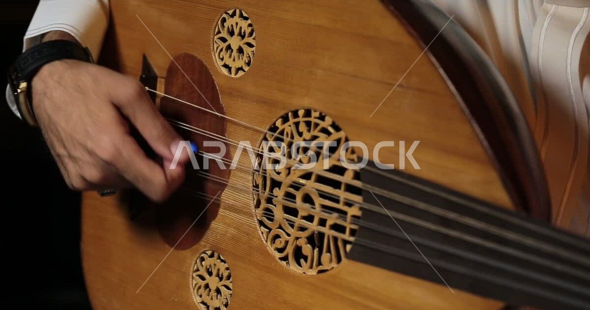 Closeup of the hand of a Saudi Arabian Gulf musician wearing