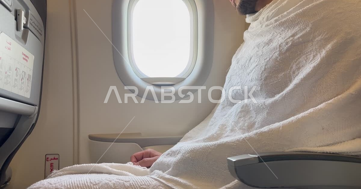 A close-up of a Saudi Arabian Gulf man sitting in the cabin of the ...