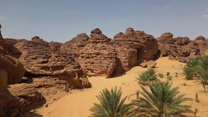 Ancient historical monuments in the Kingdom, drone photography of rock formations and formations, natural mountain peaks and heights in the desert areas of the city of Al-Ula, famous tourist places in Saudi Arabia.