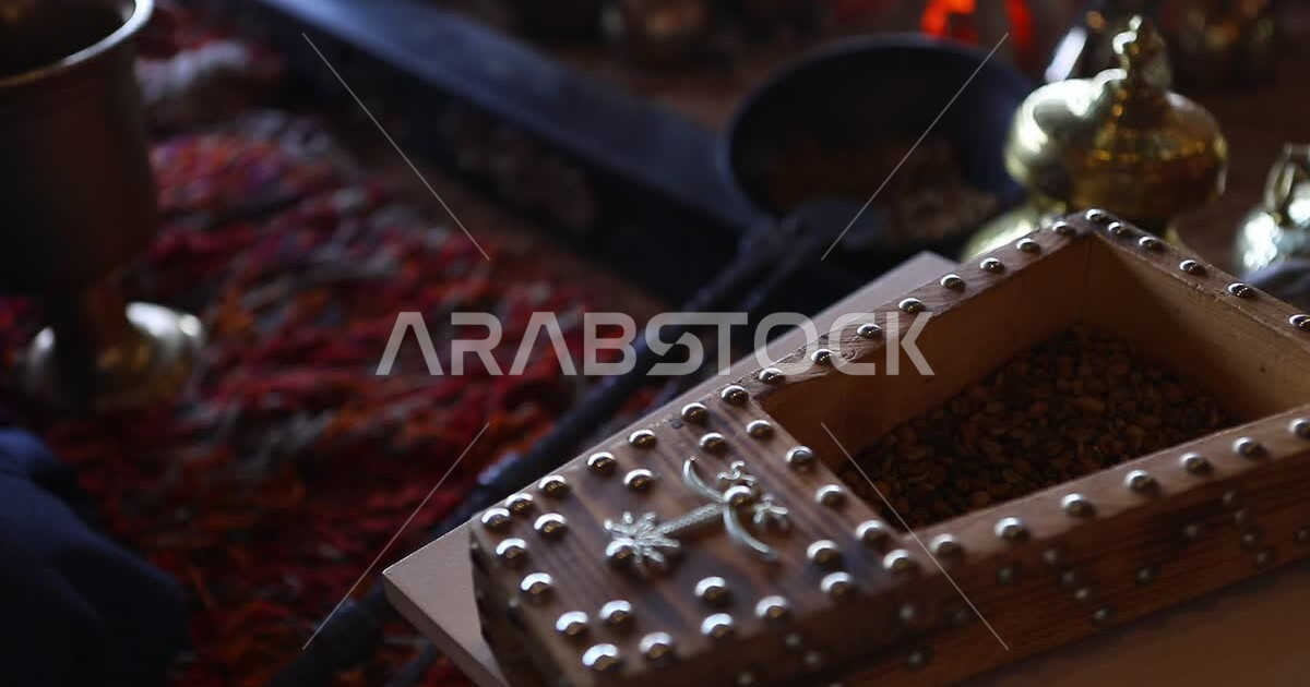 Following authentic customs in making Arabic coffee, using mills to