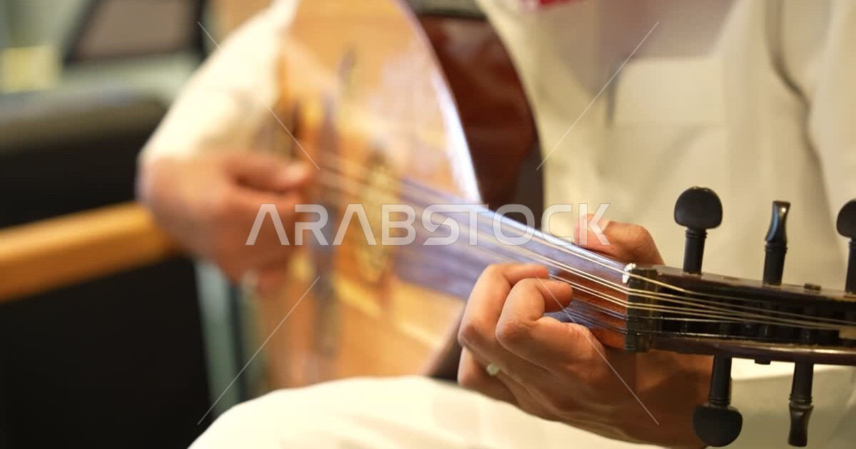 Playing traditional popular musical instruments, a close-up of the hand ...