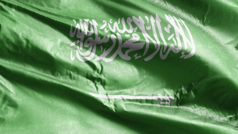 Saudi Arabia textile flag slow waving on the wind loop. Saudi Arabia banner s