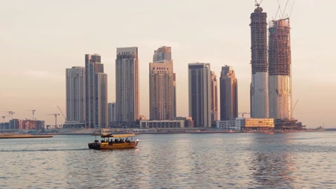 Dubai, UAE - 04.17.2021 Traditional Emirati boat called abra sailing trough c