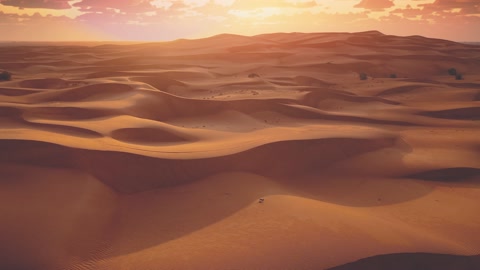 Drone flying over massive sand dunes at sunrise. Aerial bird view of desert