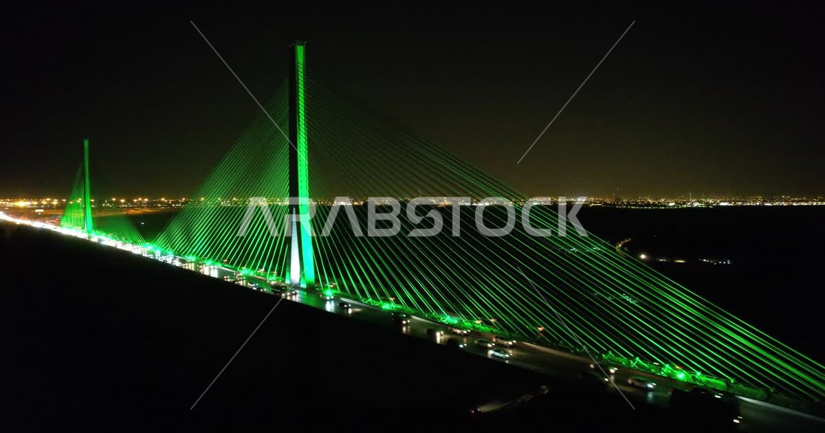 Night aerial photography of the Riyadh suspension bridge supported by ...