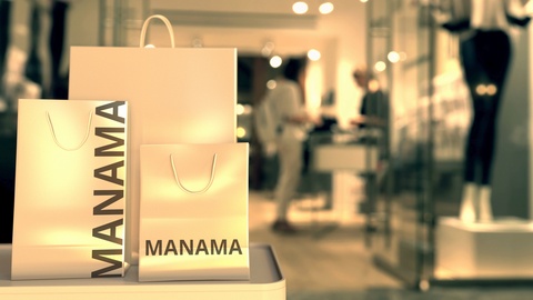 Shopping bags with Manama text. Shopping in Bahrain related conceptual 3D