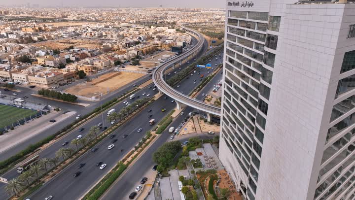 Attracting and attracting tourists from all over the world, car traffic, architectural art of towers and skyscrapers, aerial drone photography of Hilton Riyadh Hotel and Resort on King Fahd Road, famous tourist places and landmarks in Saudi Arabia