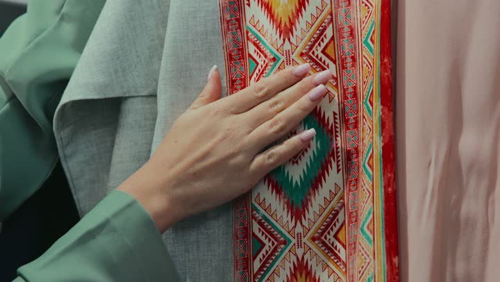Following fashion and trends, women's abayas with distinctive modern designs, enjoying a fun time shopping and buying, a photo of a smiling Emirati Gulf Arab woman wearing an elegant colorful abaya, a Saudi woman buying new clothes, veiled fashion.