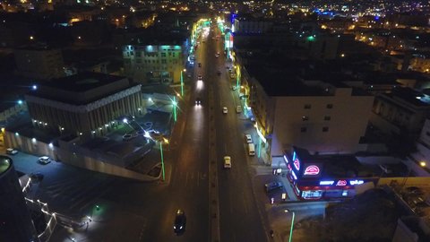 Transportation and communication in tourist cities, aerial drone photography of the Abha city road in the Kingdom of Saudi Arabia, the growth and development of infrastructure in the Asir region, and the architectural art of towers and residential and commercial buildings.