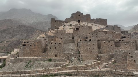 Old mud houses in the heritage village of Dhi Al Ain, plant growth on mountain peaks and heights, mountains of Al Baha region, a famous natural tourist attraction in the Kingdom of Saudi Arabia, rock formations and formations