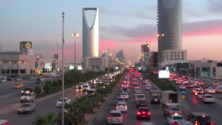 Kingdom Tower at sunset, transportation, aerial drone footage of King Fahd Road in the capital of Saudi Arabia, the growth and development of infrastructure in Riyadh, architectural art of towers and residential and commercial buildings